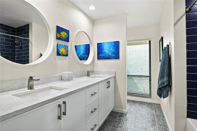 4009 Carrollwood Village Dr, Tampa, FL 33618 - full bath featuring double vanity, baseboards, a shower, and recessed lighting