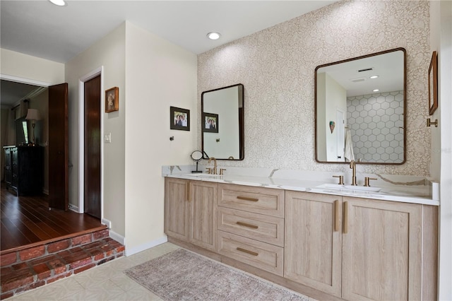 4009 Carrollwood Village Dr, Tampa, FL 33618 - bathroom with double vanity, baseboards, and recessed lighting