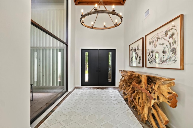 4009 Carrollwood Village Dr, Tampa, FL 33618 - entrance foyer with a high ceiling and a chandelier
