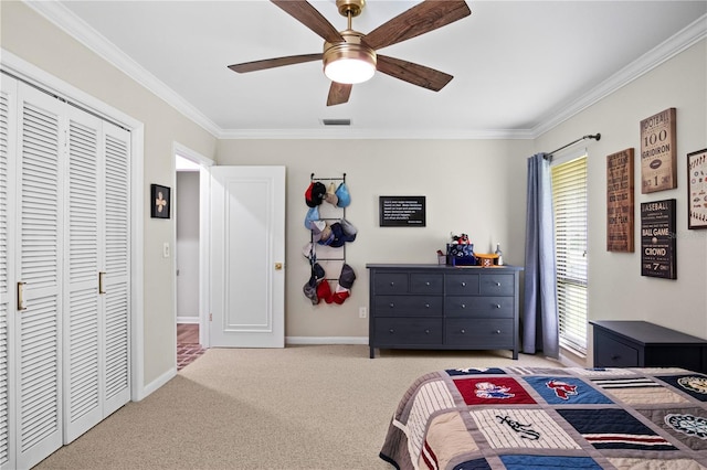 4009 Carrollwood Village Dr, Tampa, FL 33618 - carpeted bedroom featuring ornamental molding, baseboards, a ceiling fan, and a closet