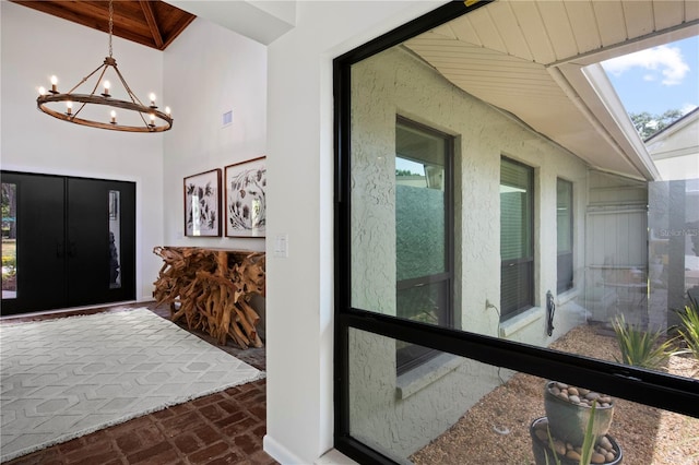 4009 Carrollwood Village Dr, Tampa, FL 33618 - foyer entrance with brick floors, a chandelier, and wooden ceiling