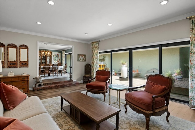 4009 Carrollwood Village Dr, Tampa, FL 33618 - living room featuring light wood-style floors, recessed lighting, a chandelier, ornamental molding, and baseboards