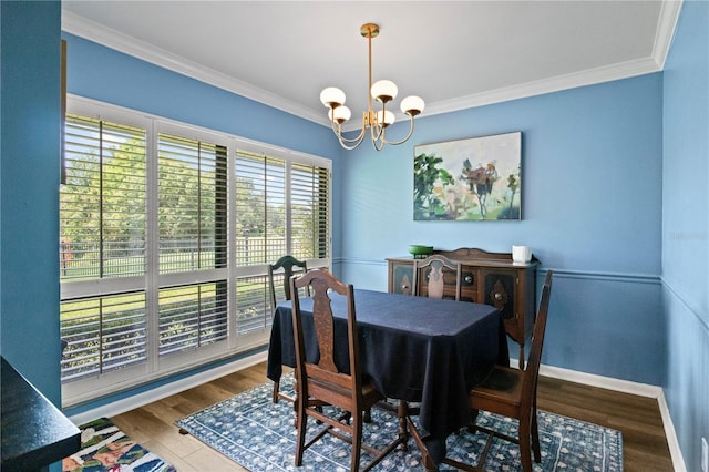 4009 Carrollwood Village Dr, Tampa, FL 33618 - dining area with a chandelier, ornamental molding, wood finished floors, and baseboards