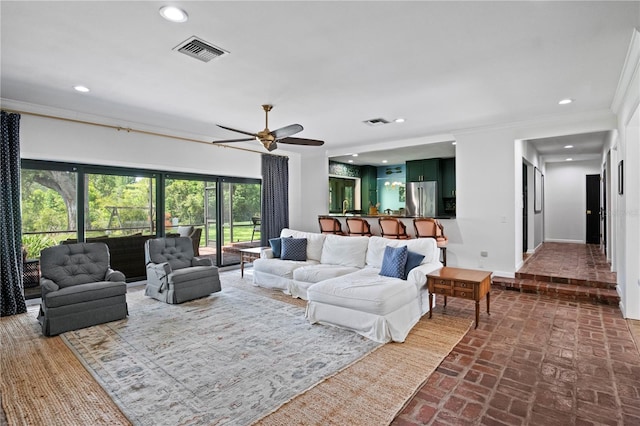 4009 Carrollwood Village Dr, Tampa, FL 33618 - living room featuring brick flooring, recessed lighting, a ceiling fan, baseboards, and crown molding