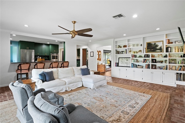 4009 Carrollwood Village Dr, Tampa, FL 33618 - living area featuring a ceiling fan, crown molding, recessed lighting, baseboards, and brick patterned floors