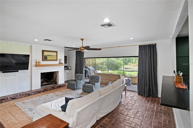 4009 Carrollwood Village Dr, Tampa, FL 33618 - living room with brick floors, ceiling fan, ornamental molding, recessed lighting, and a fireplace