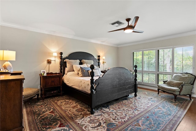 4009 Carrollwood Village Dr, Tampa, FL 33618 - bedroom with wood finished floors, ornamental molding, and ceiling fan