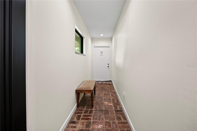 4009 Carrollwood Village Dr, Tampa, FL 33618 - corridor featuring brick floors, baseboards, and recessed lighting