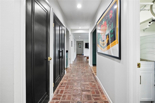 4009 Carrollwood Village Dr, Tampa, FL 33618 - hall with brick flooring, baseboards, and recessed lighting