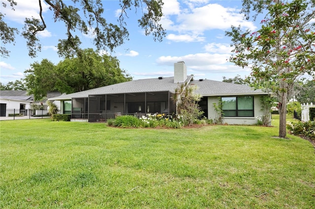 4009 Carrollwood Village Dr, Tampa, FL 33618 - back of property featuring a sunroom, a chimney, and roof with shingles