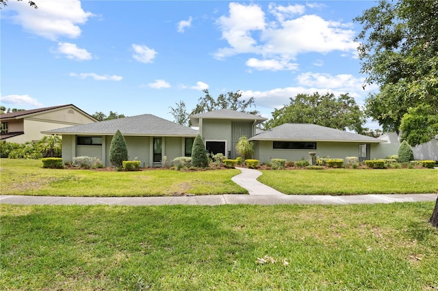 4009 Carrollwood Village Dr, Tampa, FL 33618 - view of front of property with a front yard
