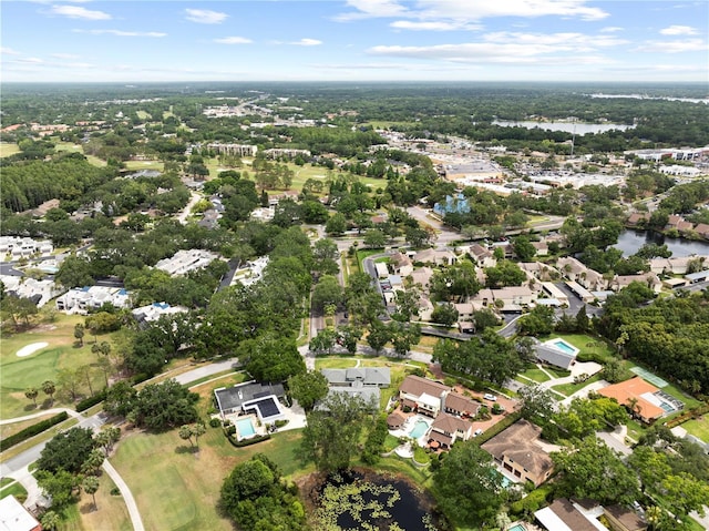 4009 Carrollwood Village Dr, Tampa, FL 33618 - aerial view of property and surrounding area with nearby suburban area, a golf club, and a nearby body of water