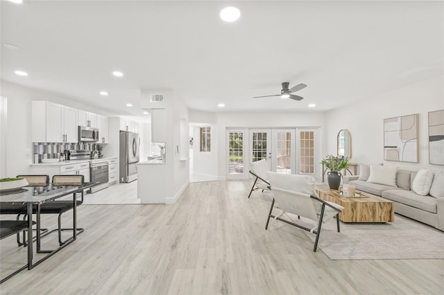 13934 Clubhouse Cir Unit 8, Tampa, FL 33618 - living room featuring ceiling fan, light wood-type flooring, recessed lighting, and baseboards
