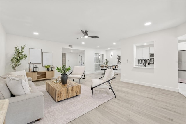 13934 Clubhouse Cir Unit 8, Tampa, FL 33618 - living area with a ceiling fan, recessed lighting, light wood-style flooring, and baseboards