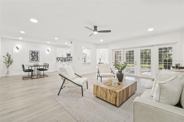 13934 Clubhouse Cir Unit 8, Tampa, FL 33618 - living area featuring french doors, ceiling fan, recessed lighting, light wood-type flooring, and baseboards