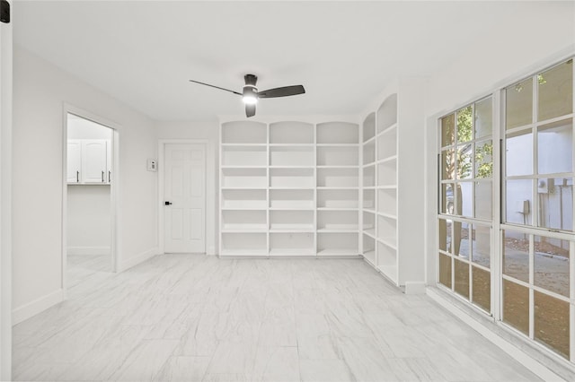 13934 Clubhouse Cir Unit 8, Tampa, FL 33618 - empty room featuring ceiling fan, marble finish floors, and baseboards