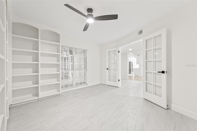 13934 Clubhouse Cir Unit 8, Tampa, FL 33618 - spare room with french doors, ceiling fan, baseboards, and marble look tiles