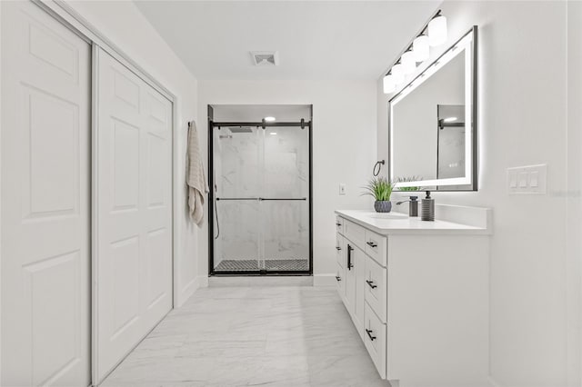 13934 Clubhouse Cir Unit 8, Tampa, FL 33618 - bathroom with marble look tile flooring, a stall shower, and vanity