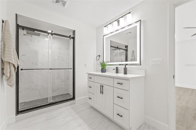 13934 Clubhouse Cir Unit 8, Tampa, FL 33618 - full bath with a marble finish shower, marble look tiles, baseboards, and vanity