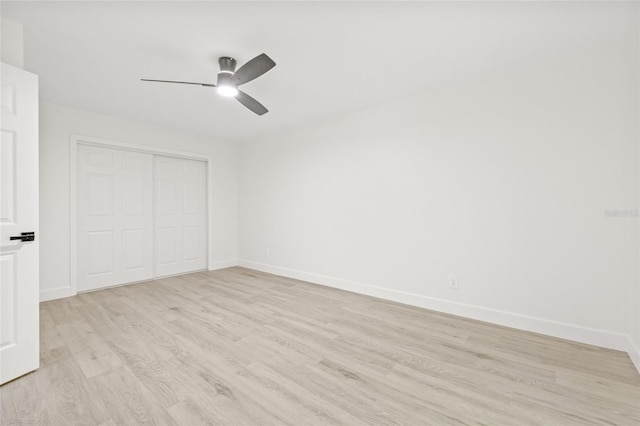 13934 Clubhouse Cir Unit 8, Tampa, FL 33618 - unfurnished bedroom with light wood-style floors, a closet, baseboards, and ceiling fan