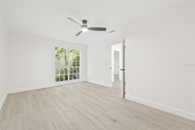13934 Clubhouse Cir Unit 8, Tampa, FL 33618 - empty room with a ceiling fan, light wood-style flooring, and baseboards