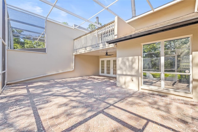 13934 Clubhouse Cir Unit 8, Tampa, FL 33618 - view of patio featuring french doors, a balcony, a ceiling fan, and a lanai
