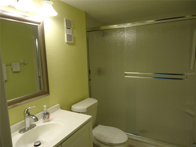 860 Virginia St Unit 308, Dunedin, FL 34698 - bathroom featuring a stall shower, toilet, and vanity
