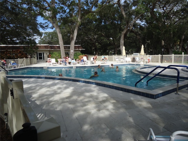 860 Virginia St Unit 308, Dunedin, FL 34698 - community pool featuring fence and a patio area