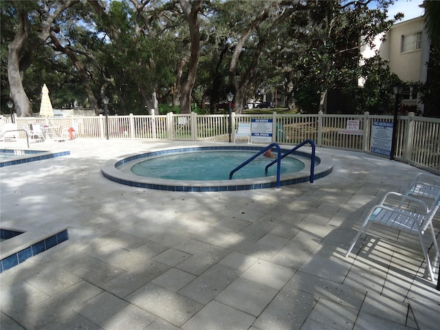 860 Virginia St Unit 308, Dunedin, FL 34698 - view of pool featuring fence, a swimming pool, and a patio area