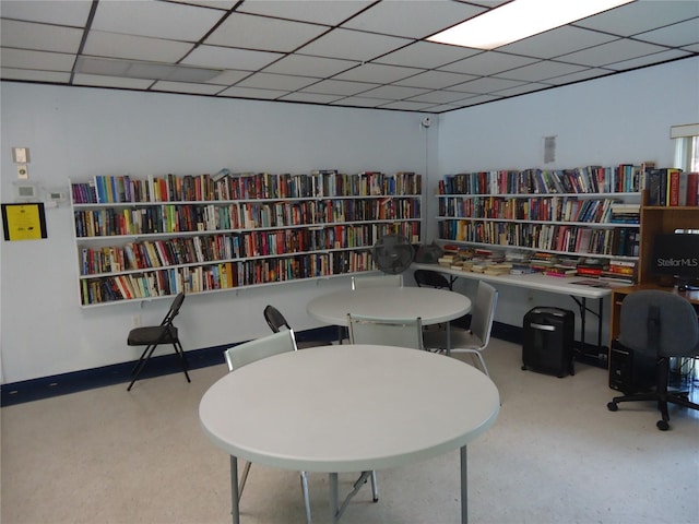 860 Virginia St Unit 308, Dunedin, FL 34698 - sitting room featuring bookshelves and a drop ceiling