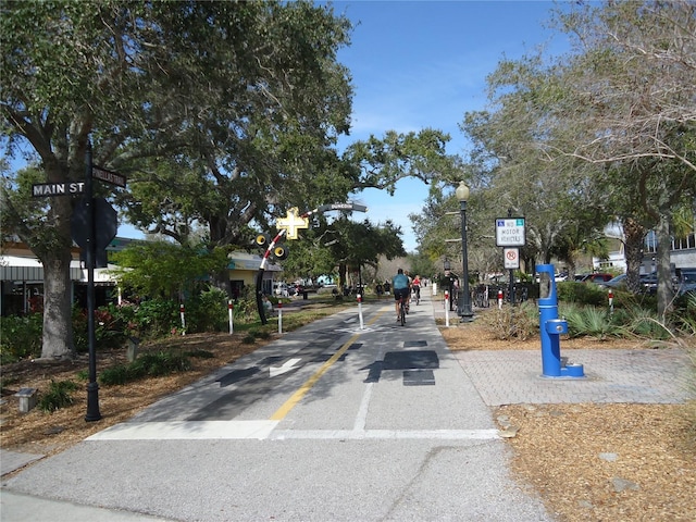 860 Virginia St Unit 308, Dunedin, FL 34698 - view of asphalt road featuring traffic signs