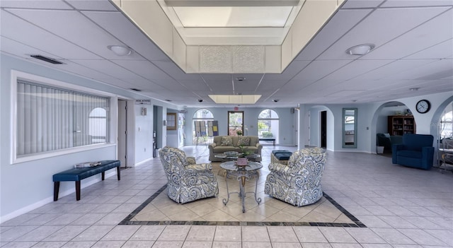 community lobby featuring a drop ceiling
