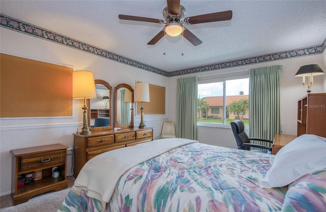 19029 US Highway 19 N Unit 31F, Clearwater, FL 33764 - carpeted bedroom featuring a textured ceiling and a ceiling fan