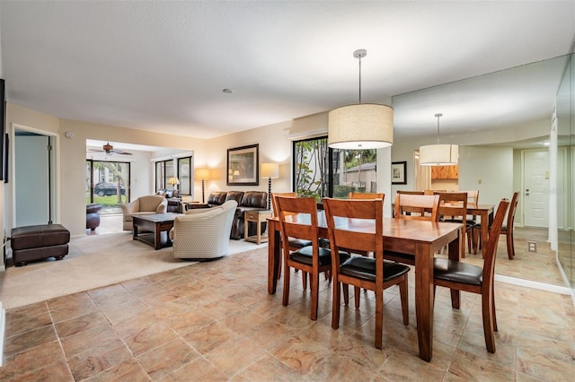 11440 Harbor Way Unit 5009, Largo, FL 33774 - dining room with plenty of natural light, ceiling fan, and light stone finish floors