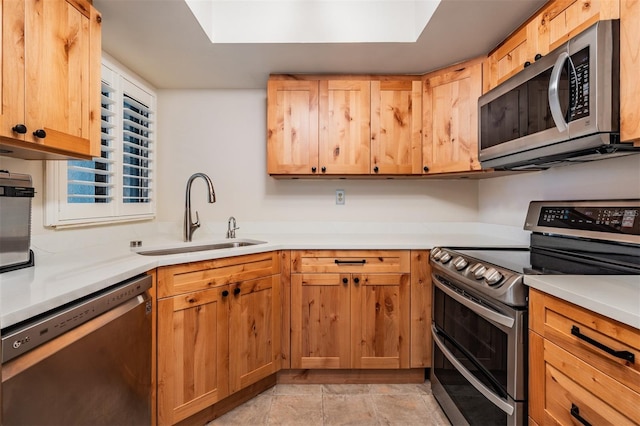 11440 Harbor Way Unit 5009, Largo, FL 33774 - kitchen with stainless steel appliances, a sink, and light countertops