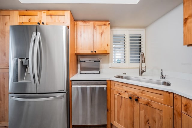 11440 Harbor Way Unit 5009, Largo, FL 33774 - kitchen featuring appliances with stainless steel finishes, a sink, light brown cabinets, and light countertops