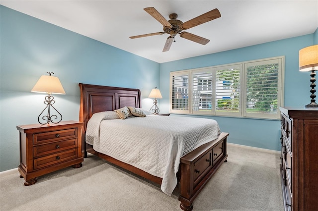 11440 Harbor Way Unit 5009, Largo, FL 33774 - bedroom with light colored carpet, baseboards, and a ceiling fan