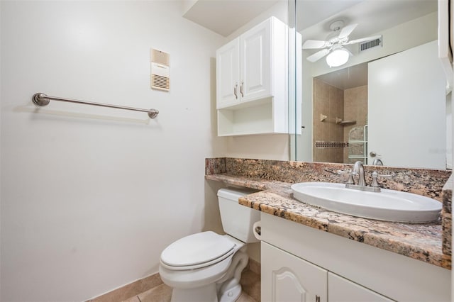 11440 Harbor Way Unit 5009, Largo, FL 33774 - bathroom with ceiling fan, toilet, tile patterned flooring, vanity, and a tile shower