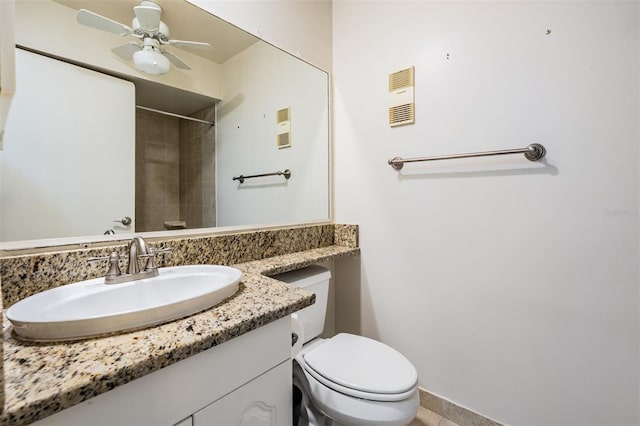 11440 Harbor Way Unit 5009, Largo, FL 33774 - full bathroom featuring toilet, ceiling fan, vanity, a shower, and baseboards