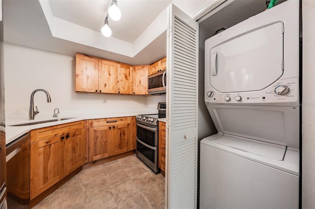 11440 Harbor Way Unit 5009, Largo, FL 33774 - clothes washing area featuring stacked washing machine and dryer