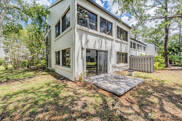 11440 Harbor Way Unit 5009, Largo, FL 33774 - rear view of property featuring stucco siding and a deck