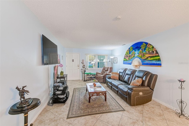 11200 102nd Ave Unit 75, Seminole, FL 33778 - living room featuring a textured ceiling, light tile patterned flooring, and baseboards