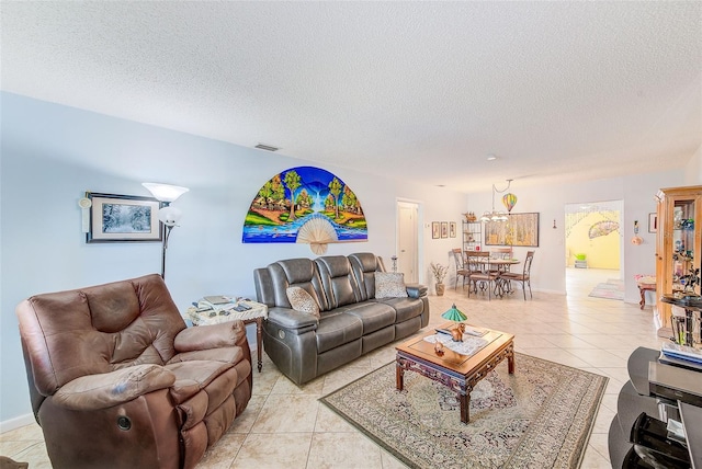 11200 102nd Ave Unit 75, Seminole, FL 33778 - living area featuring light tile patterned flooring and a textured ceiling