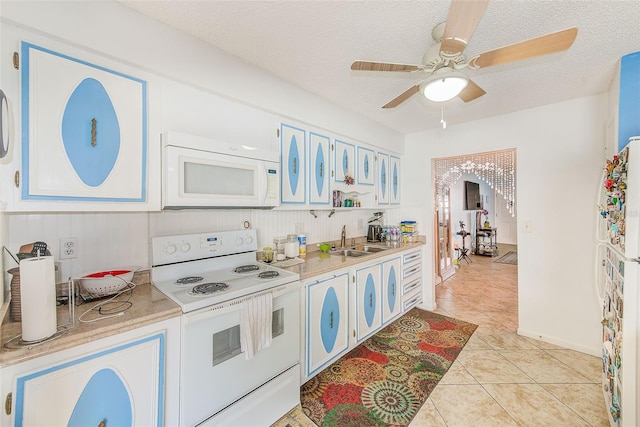 11200 102nd Ave Unit 75, Seminole, FL 33778 - kitchen with white appliances, a sink, light countertops, light tile patterned floors, and a textured ceiling
