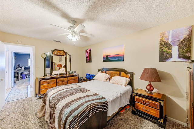 11200 102nd Ave Unit 75, Seminole, FL 33778 - carpeted bedroom featuring ceiling fan, a textured ceiling, and baseboards