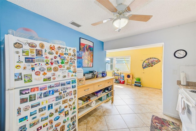 11200 102nd Ave Unit 75, Seminole, FL 33778 - playroom featuring a textured ceiling, ceiling fan, and light tile patterned flooring