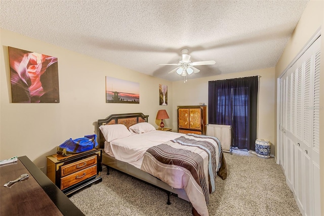 11200 102nd Ave Unit 75, Seminole, FL 33778 - bedroom with a closet, carpet floors, a textured ceiling, and a ceiling fan