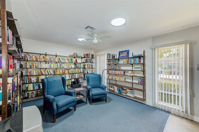 11200 102nd Ave Unit 75, Seminole, FL 33778 - sitting room with ceiling fan and bookshelves