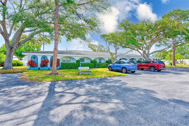 11200 102nd Ave Unit 75, Seminole, FL 33778 - view of front facade featuring uncovered parking and stucco siding
