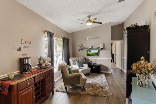 2816 Manor Hill Dr, Brandon, FL 33511 - living room with a ceiling fan, a textured ceiling, lofted ceiling, and wood finished floors